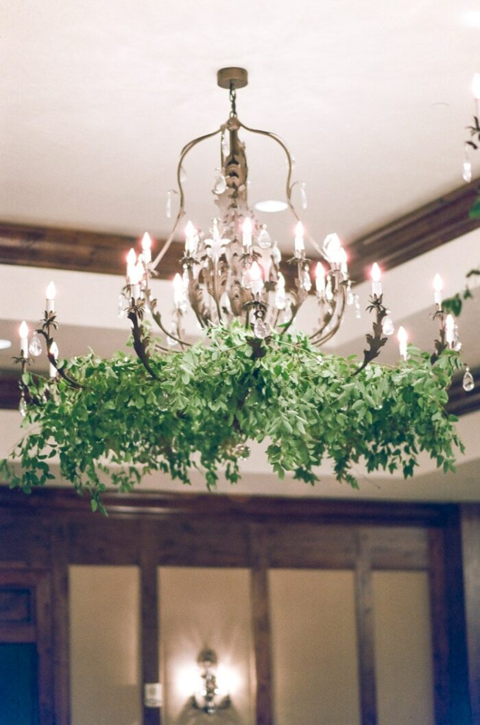 Chandelier decorated with greenery