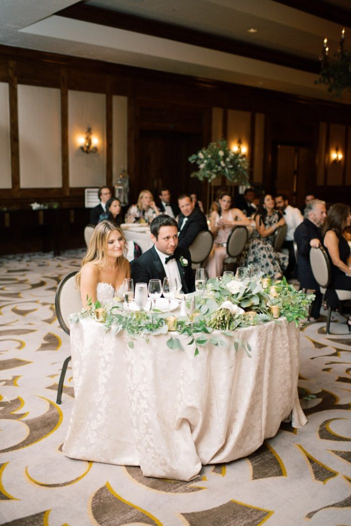 Wedding reception groom and bride sitting together