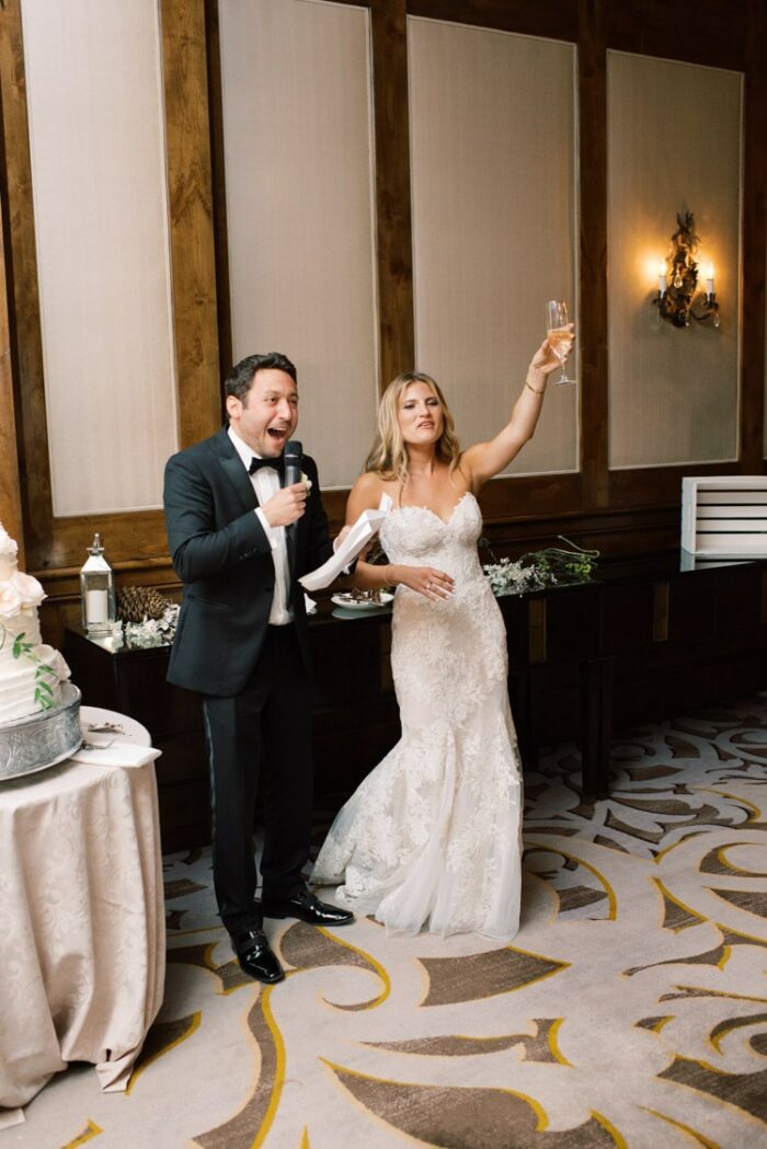 Husband giving speech with wife toasting