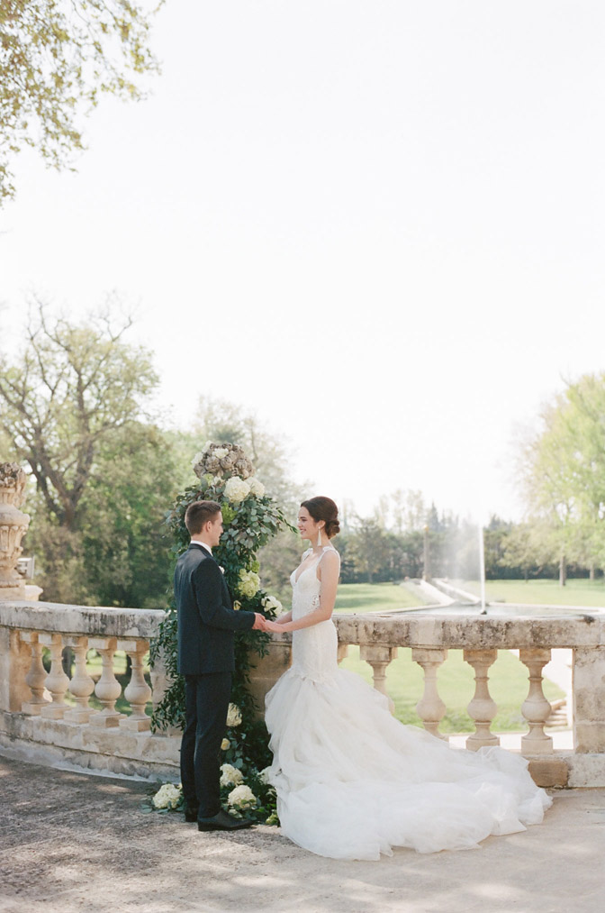 Intimate French wedding with backdrop of landscape over railing