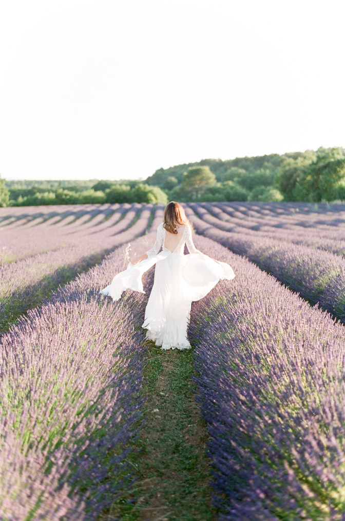 Session of bride in white dress in lavender field