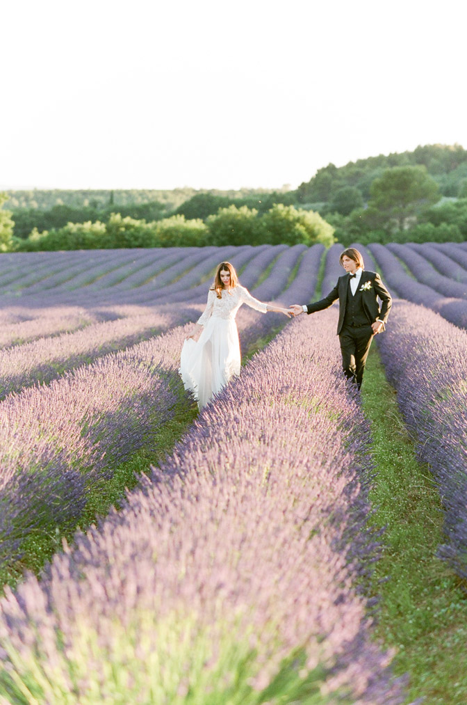 Couple holding hands at lavender fields in France