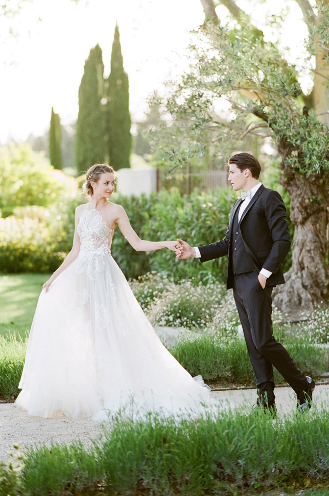 Wedding couple holding hands and walking together