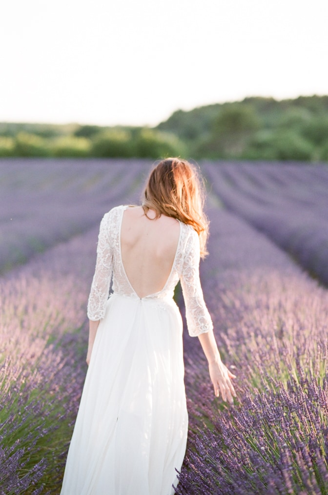 Bride touching lavender in the Luberon in Provence