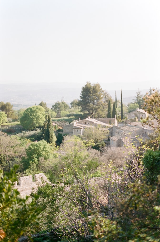 Oppède le Vieux village from afar photographed by luxury destination wedding photographer Tamara Gruner