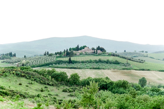 Tuscany's landscape with cypresses and small village