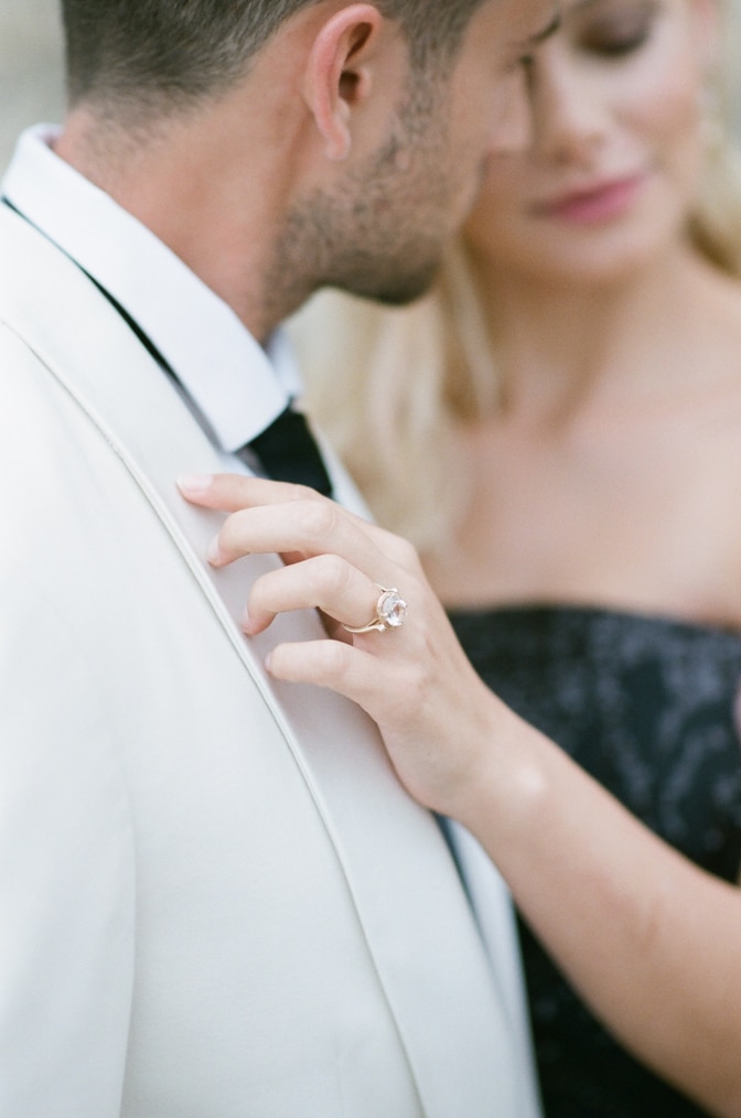 Closeup of a diamond ring in rose gold frame by Michaela Roemer