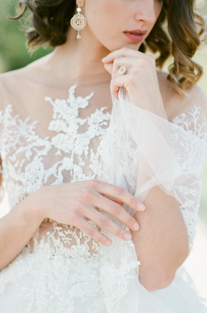 Closeup of a bride and her fine jewelry by Michaela Roemer