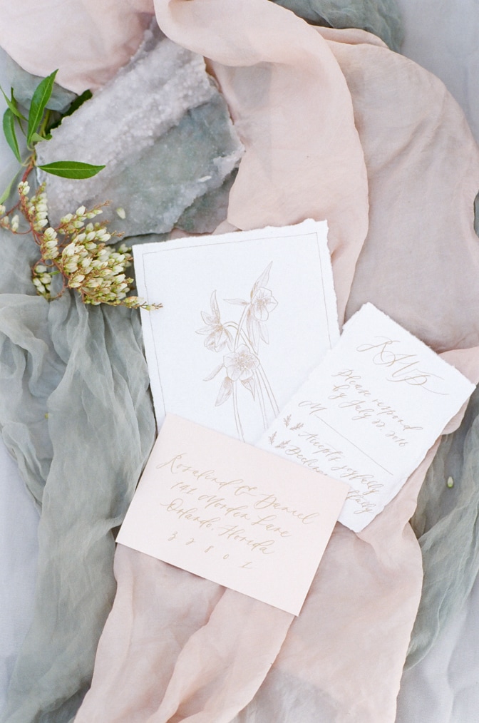 Closeup of luxury romantic wedding invitation photographed by luxury destination wedding photographer Tamara Gruner