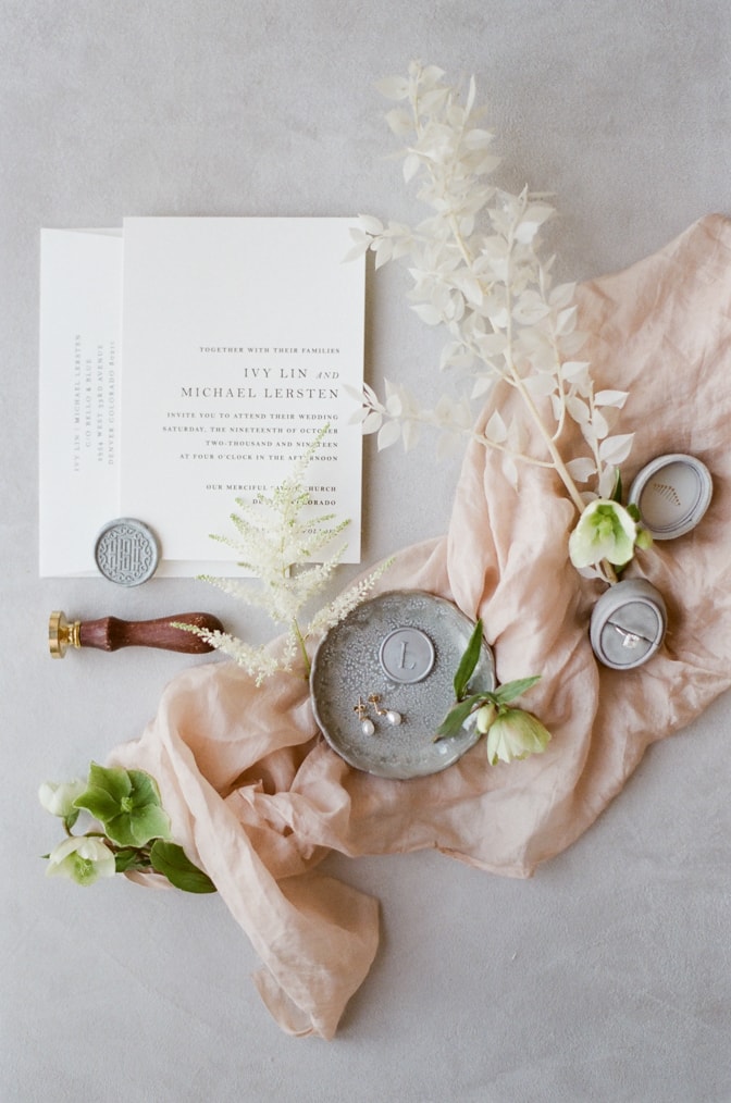 modern and romantic wedding invitation decorated with blush silk and flowers