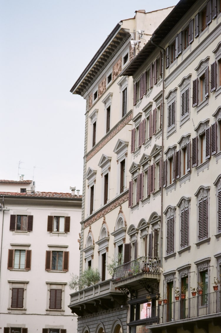 Beige colored buildings surrounding the Cathedral in Florence Italy