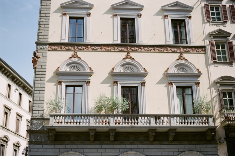 The balcony of a building surrounding the Cathedral in Florence Italy