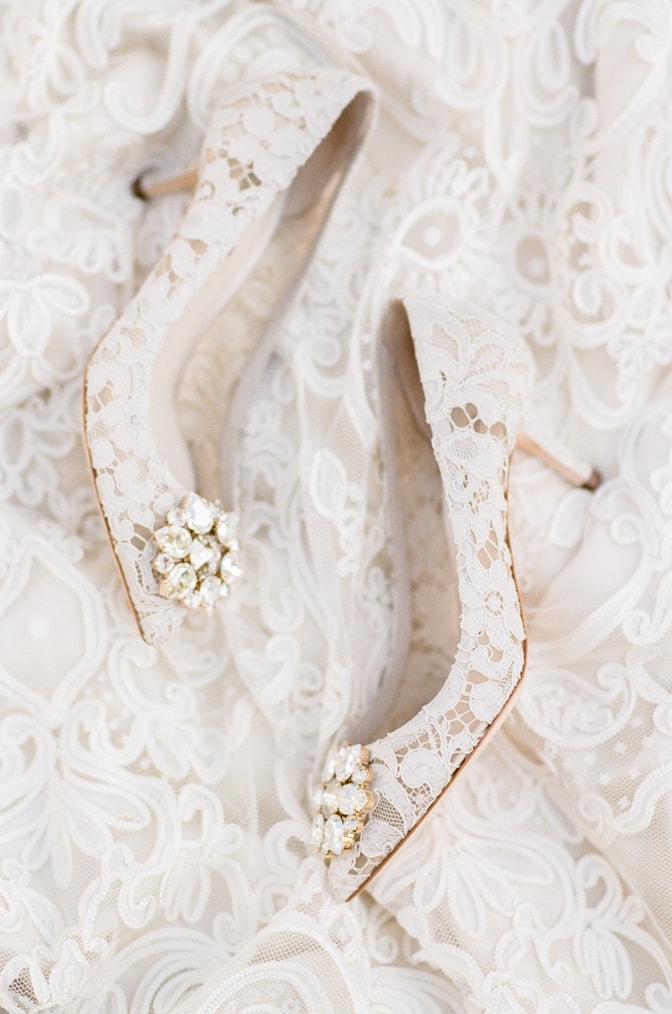 White lace Manolo Blahnik wedding shoes from the side