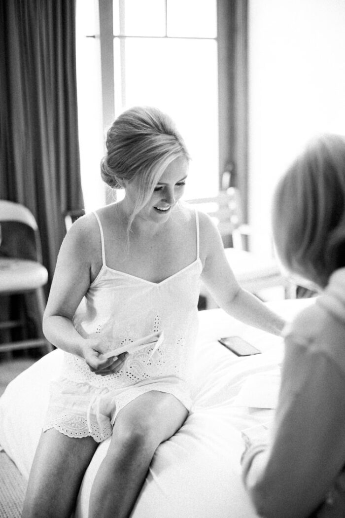 Bride opening a present from her mom at Four Seasons Vail