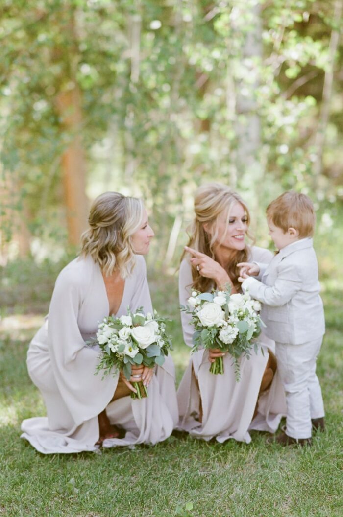 Bridesmaids talking to ring bearer at Eaton Ranch wedding