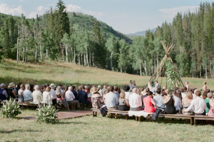 Wedding guests sitting at wedding ceremony during Eaton Ranch wedding