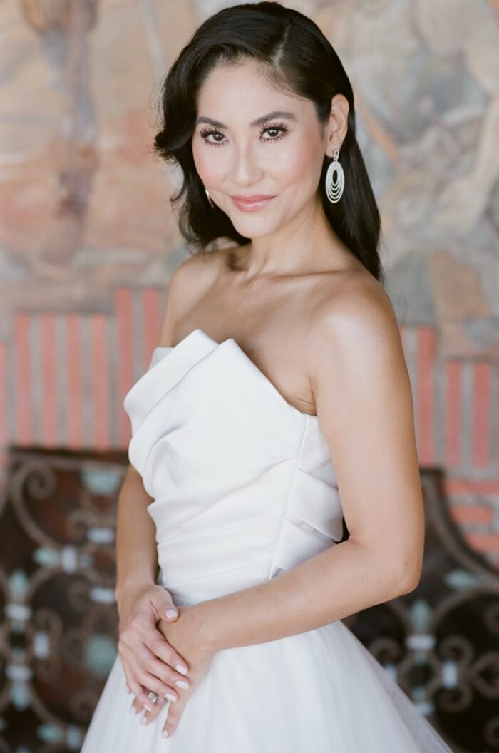 Bride in her Tadashi Shoji wedding gown facing California wedding photographer Tamara Gruner