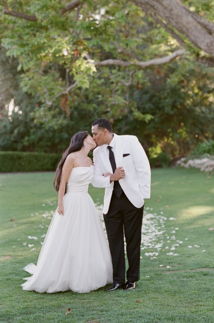 Bride and groom kissing during their California wedding