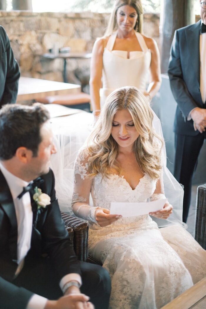 Bride and groom reading their vows out loud before signing the Ketubah at the Ritz Carlton Bachelor Gulch
