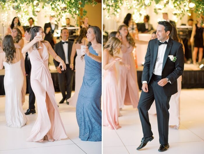 Wedding guests dancing on dance floor under a floral ceiling installation