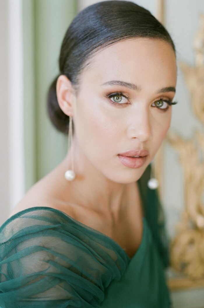 Closeup of bride in green dress