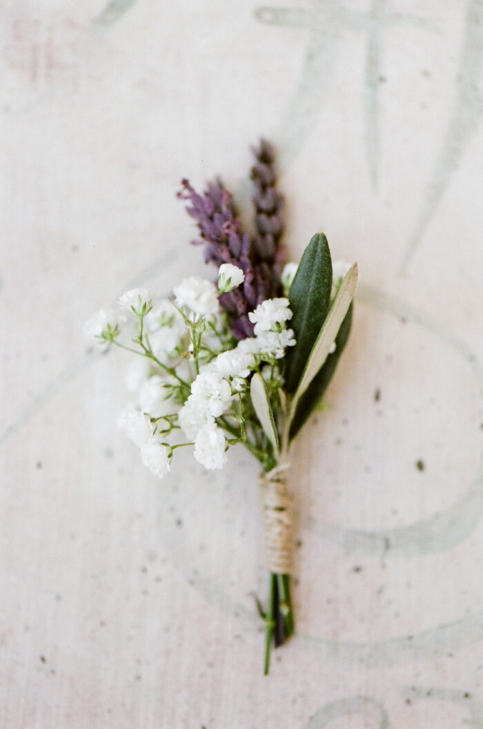 Groom's boutonniere with lavender