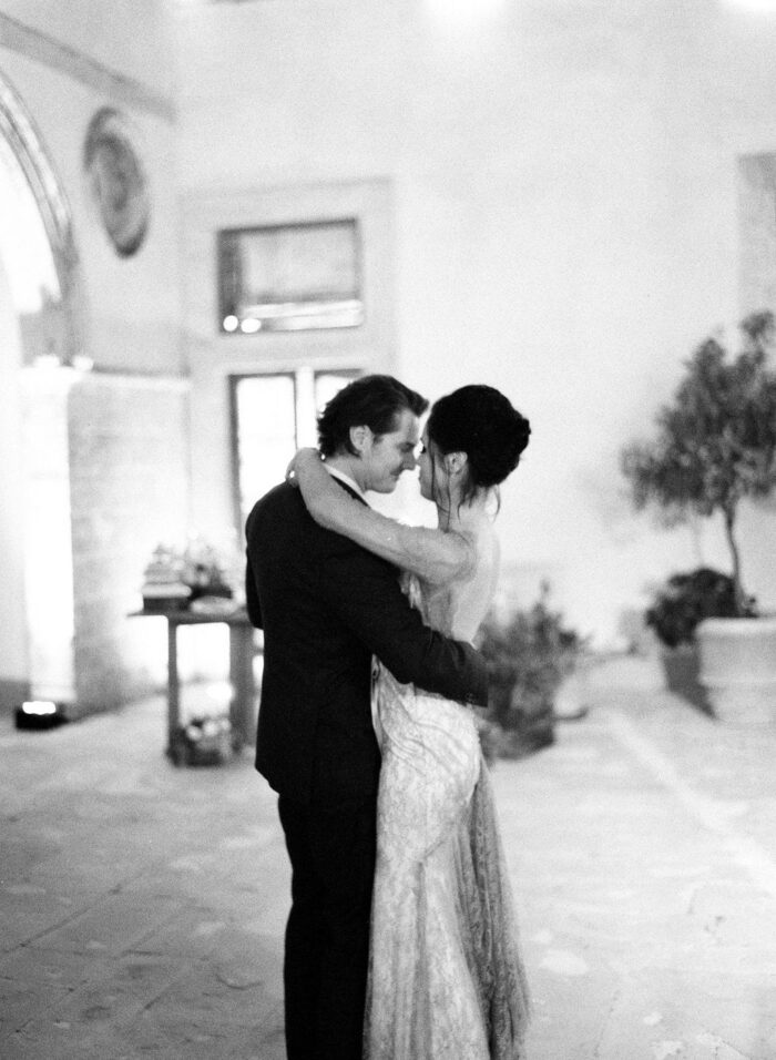 Bride and groom dancing nose to nose