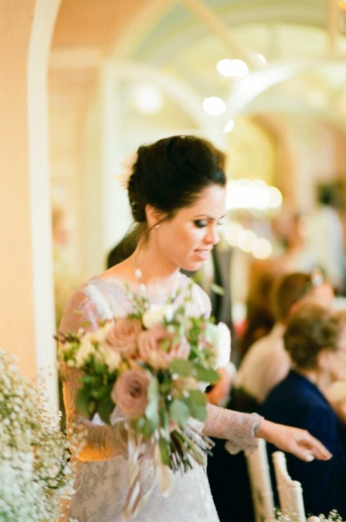 Bride walking into wedding reception