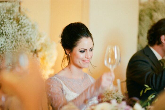 Bride cheering with Italian wine