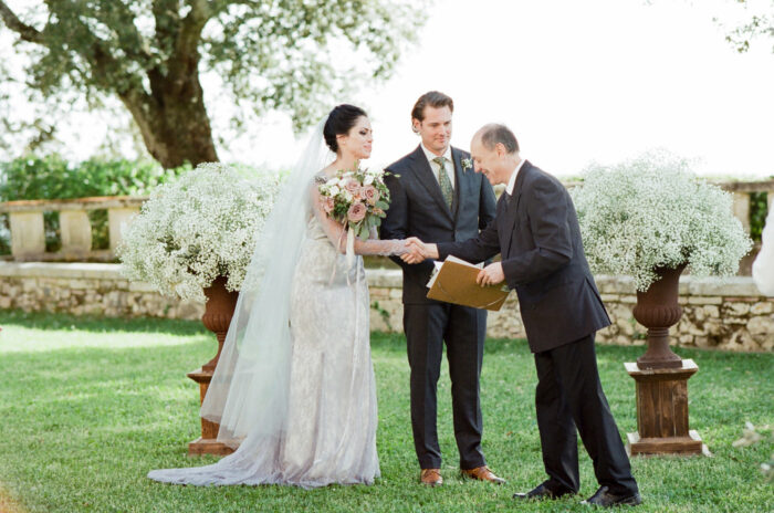 Bride shaking hand of officiant