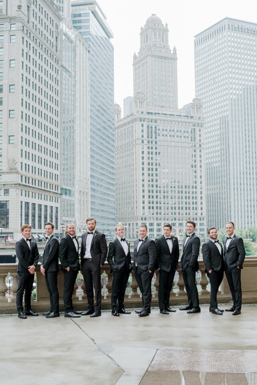 Groom with groomsmen at Wrigley Building in Chicago