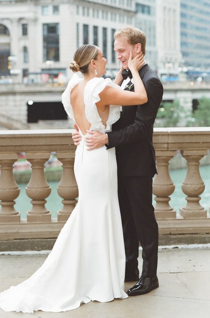 Bride and groom embracing each other at their first look
