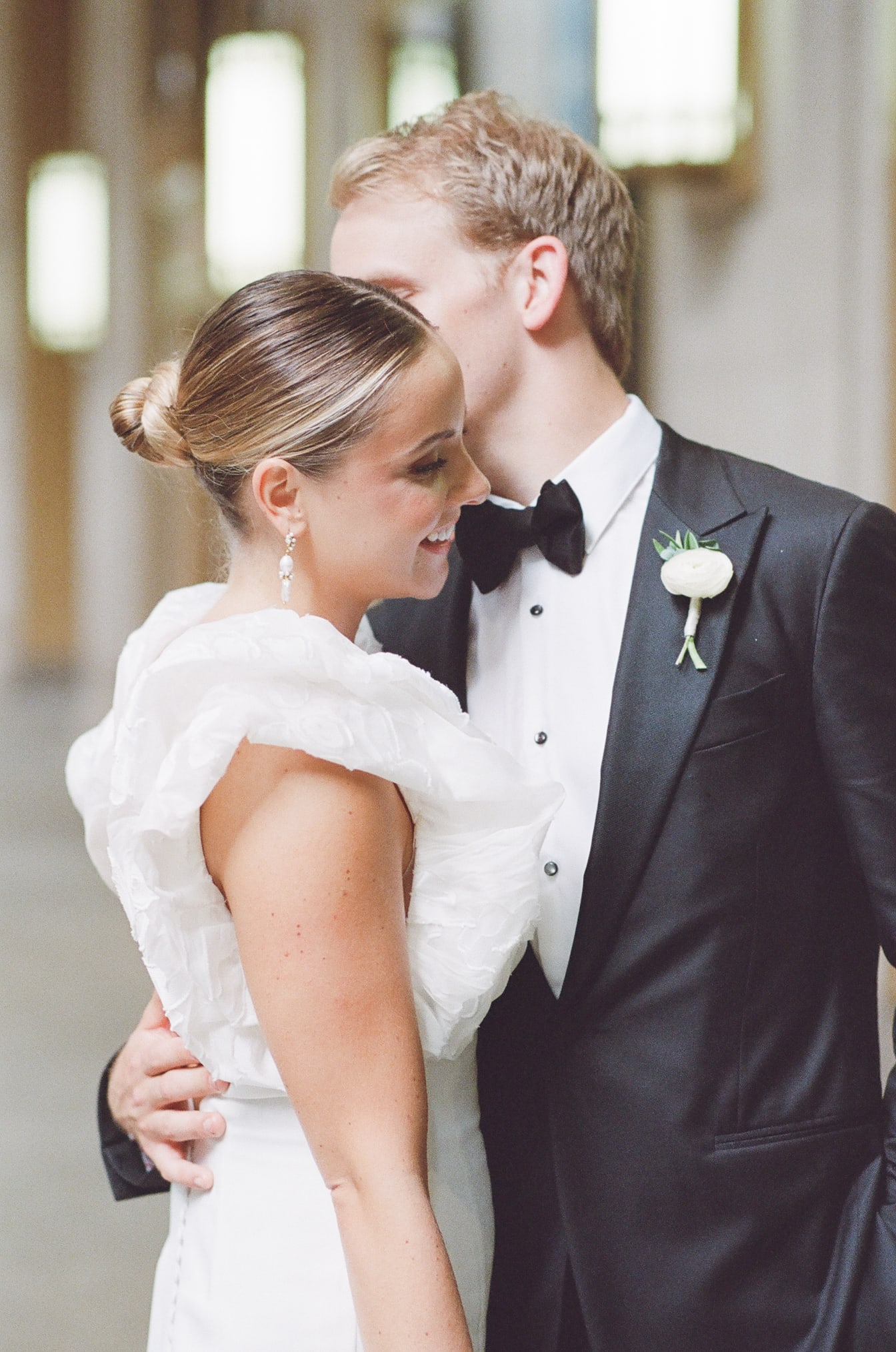 Groom kissing his bride at Lyric Opera House