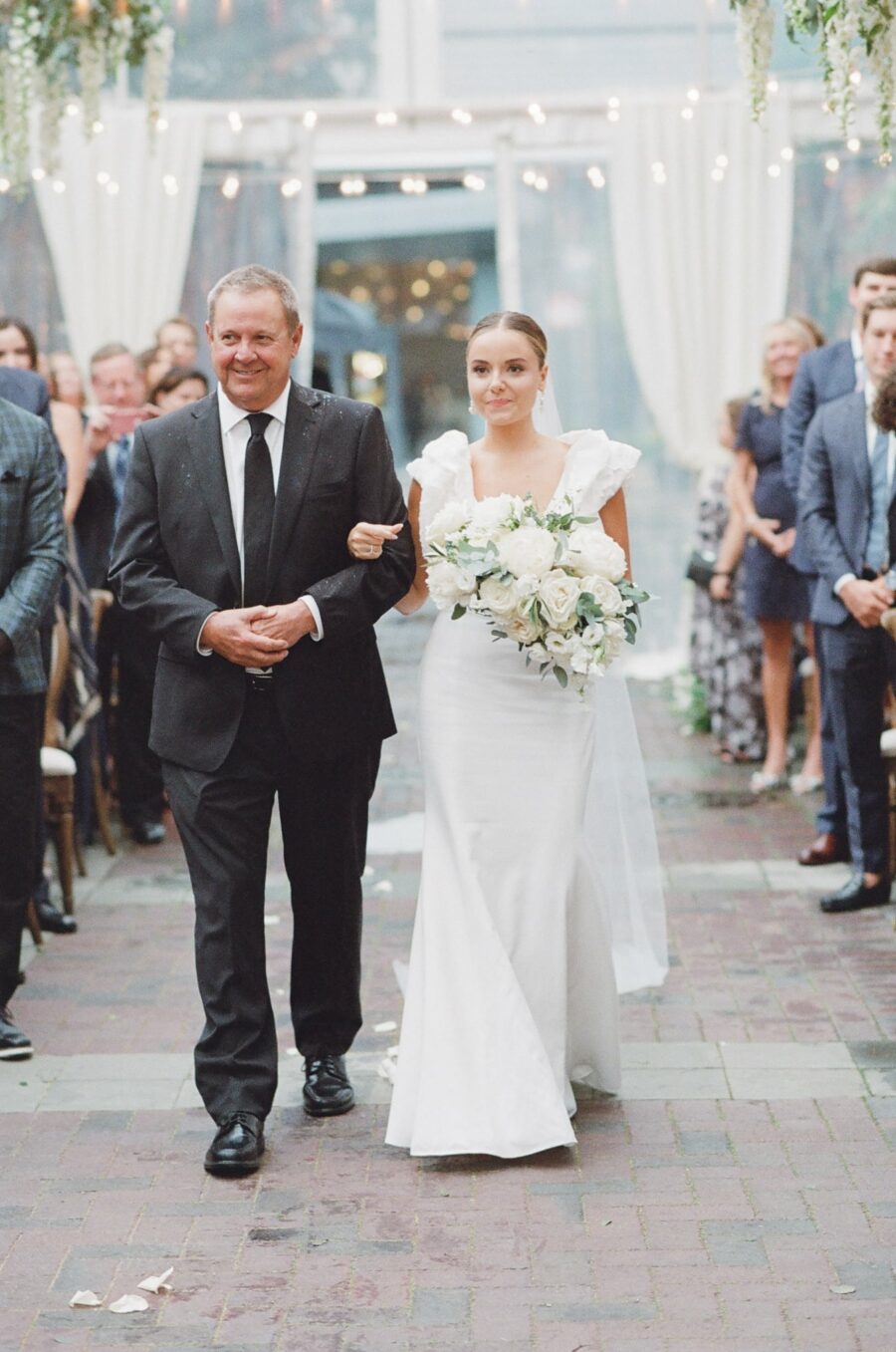 Bride and her father walking down the aisle at Chicago Illuminating Company