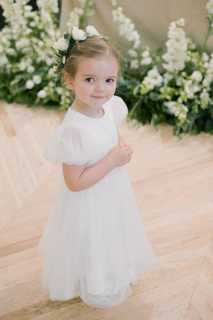 Flower girl smiling into camera at Chicago Illuminating Company