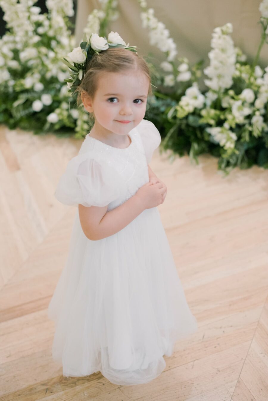 Flower girl smiling into camera at Chicago Illuminating Company