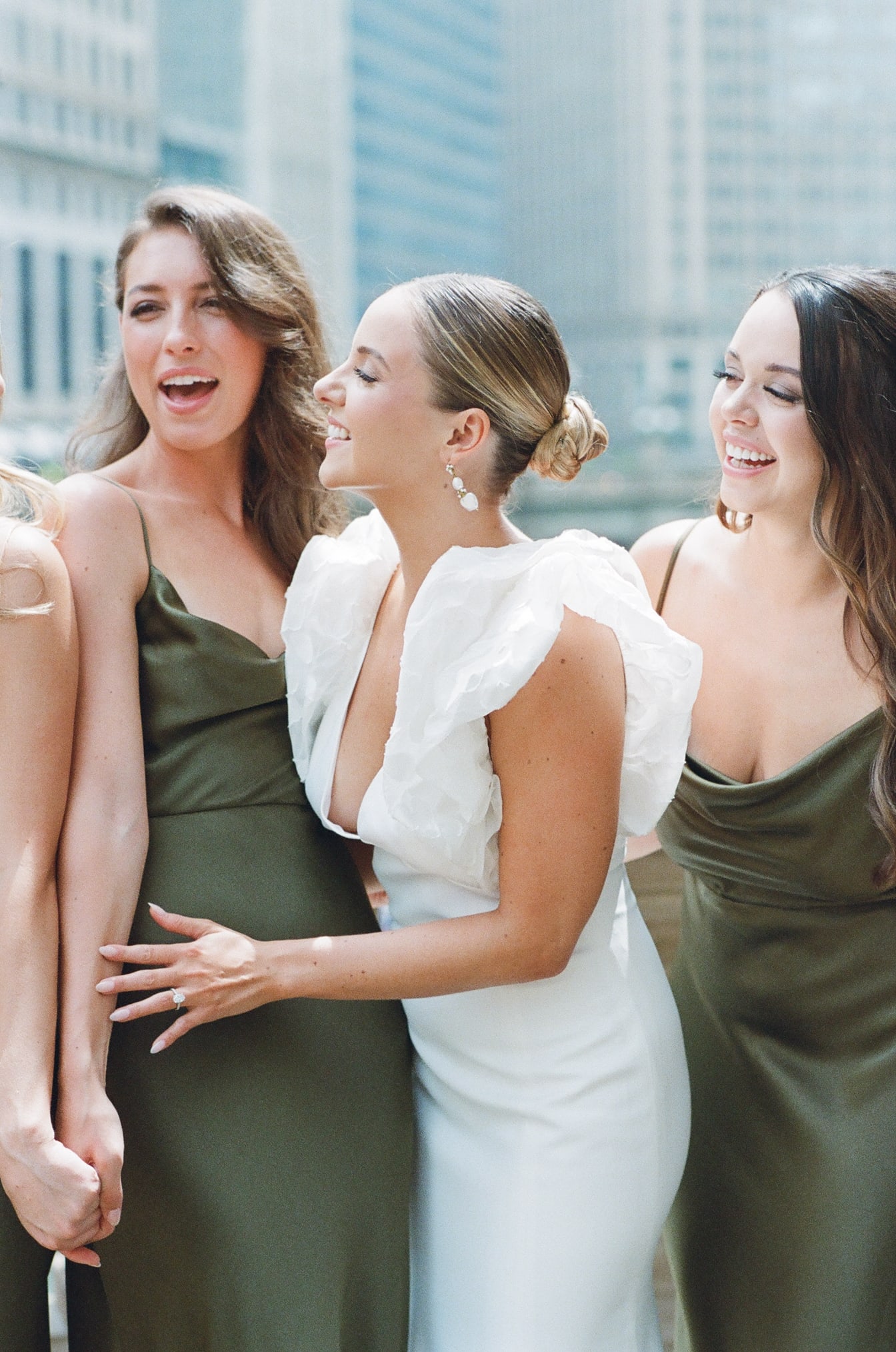 Bride laughing together with her bridesmaids in Chicago