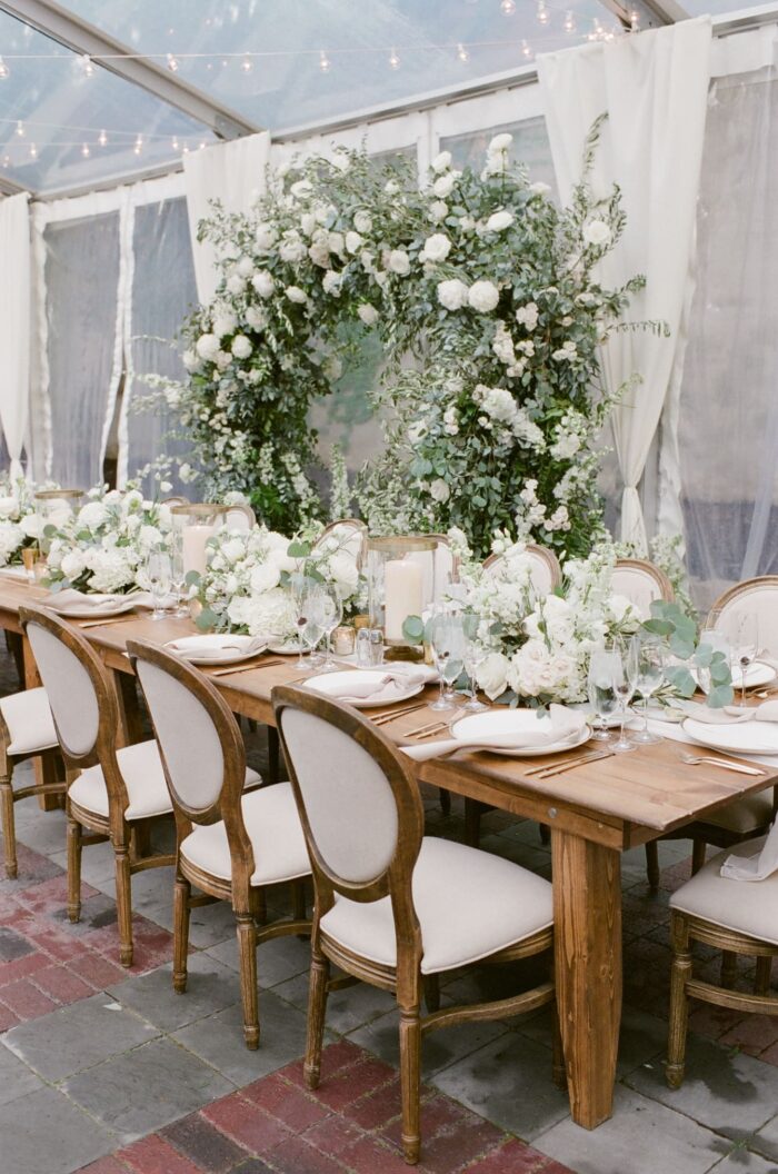 Floral arch decor in whites and greens