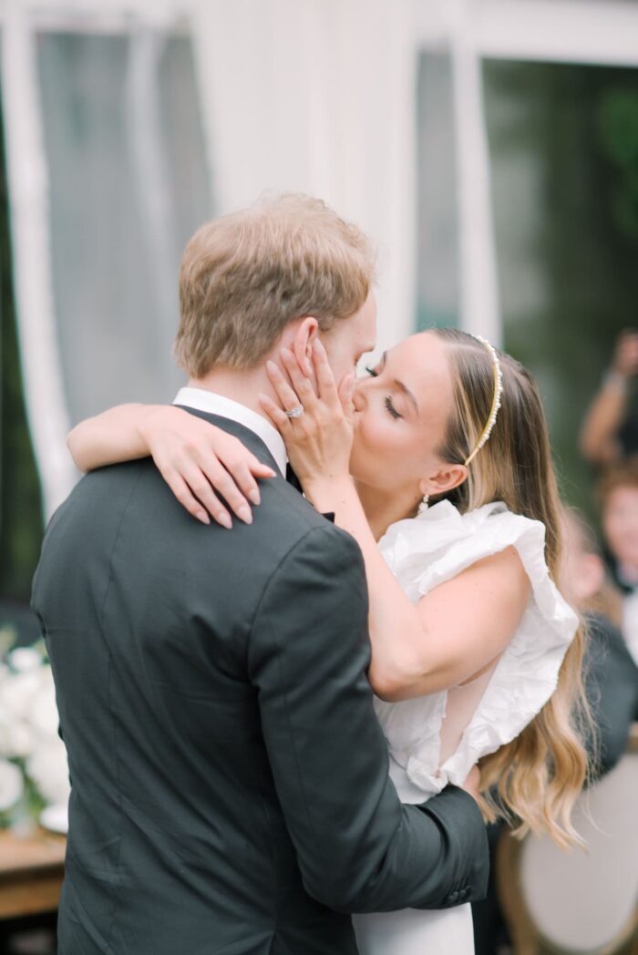 First kiss of bride and groom during first dance at Chicago Wedding