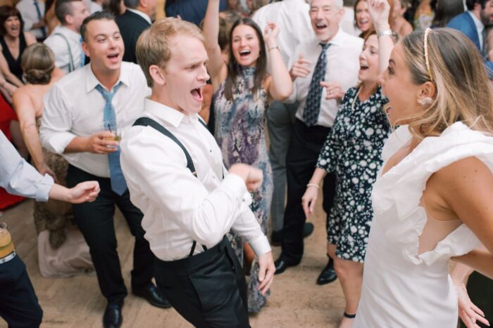 Bride and groom dancing with wedding guests at Chicago Illuminating Company