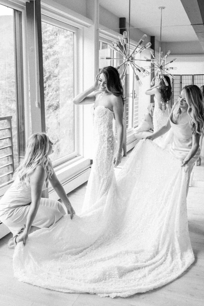 Aspen bride getting into her Galia Lahav dress