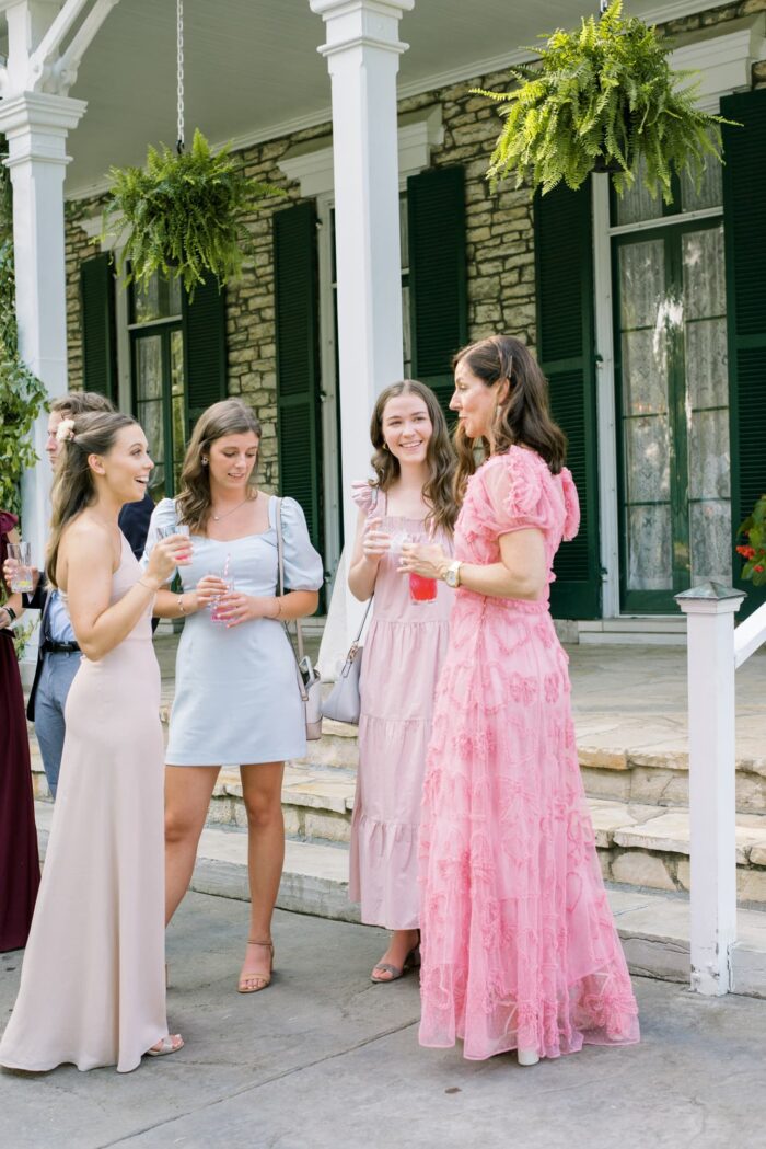 St Louis wedding guests talking to each other during cocktail reception