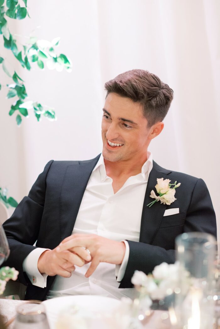 Groom listening to father's speech