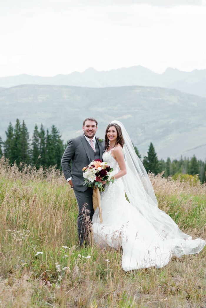 Bride and groom on Beaver Creek mountain top in Colorado