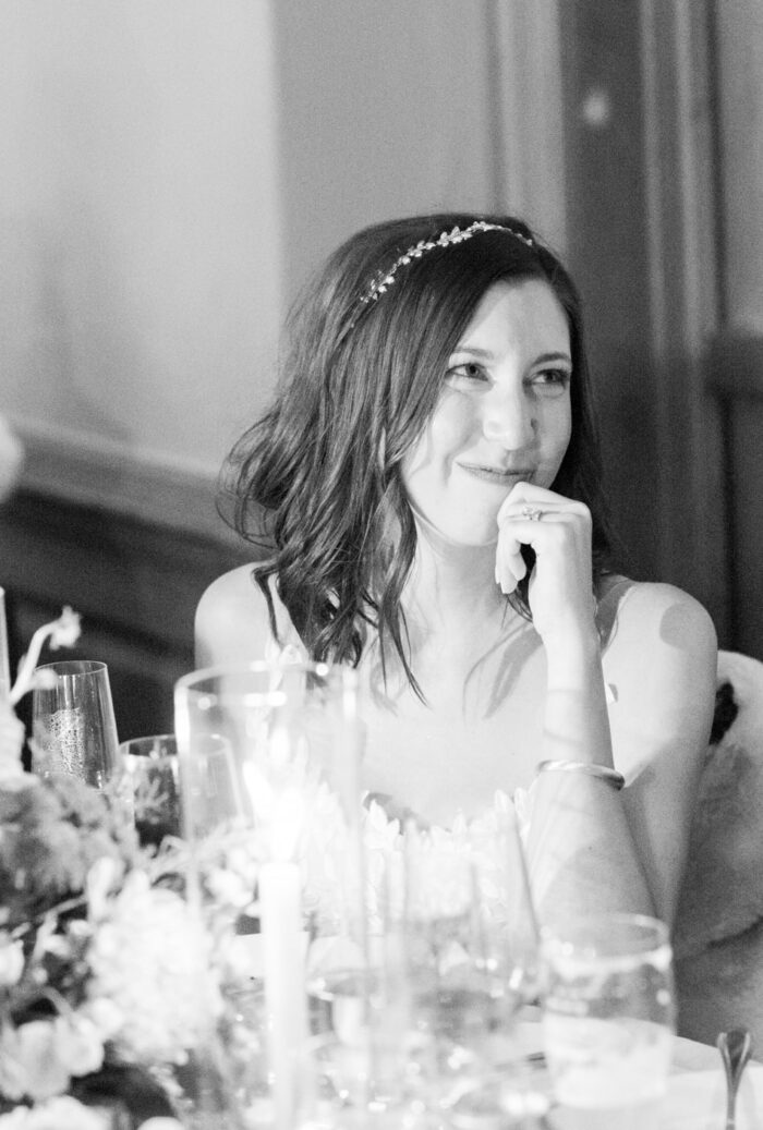 Bride smiling during speeches