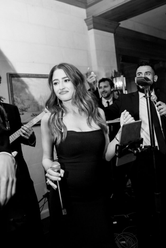 Band member singing during wedding reception