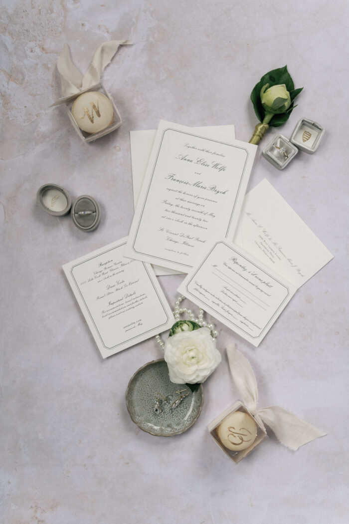 Closeup of white and black invitation suite