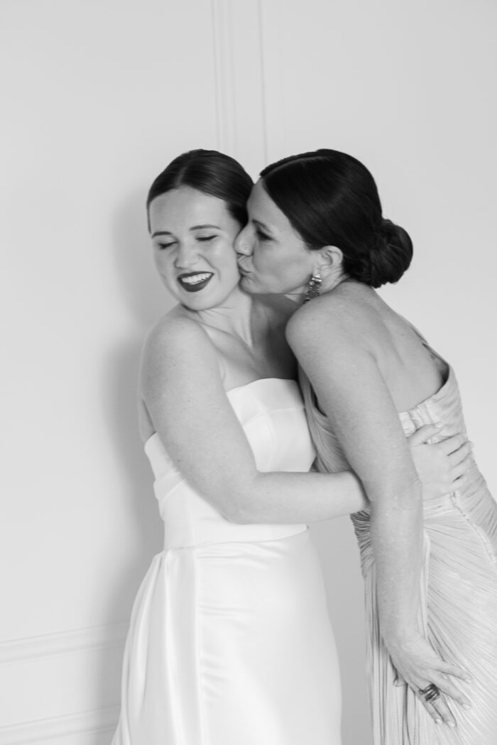 Mother of bride kissing bride at Pendry Chicago