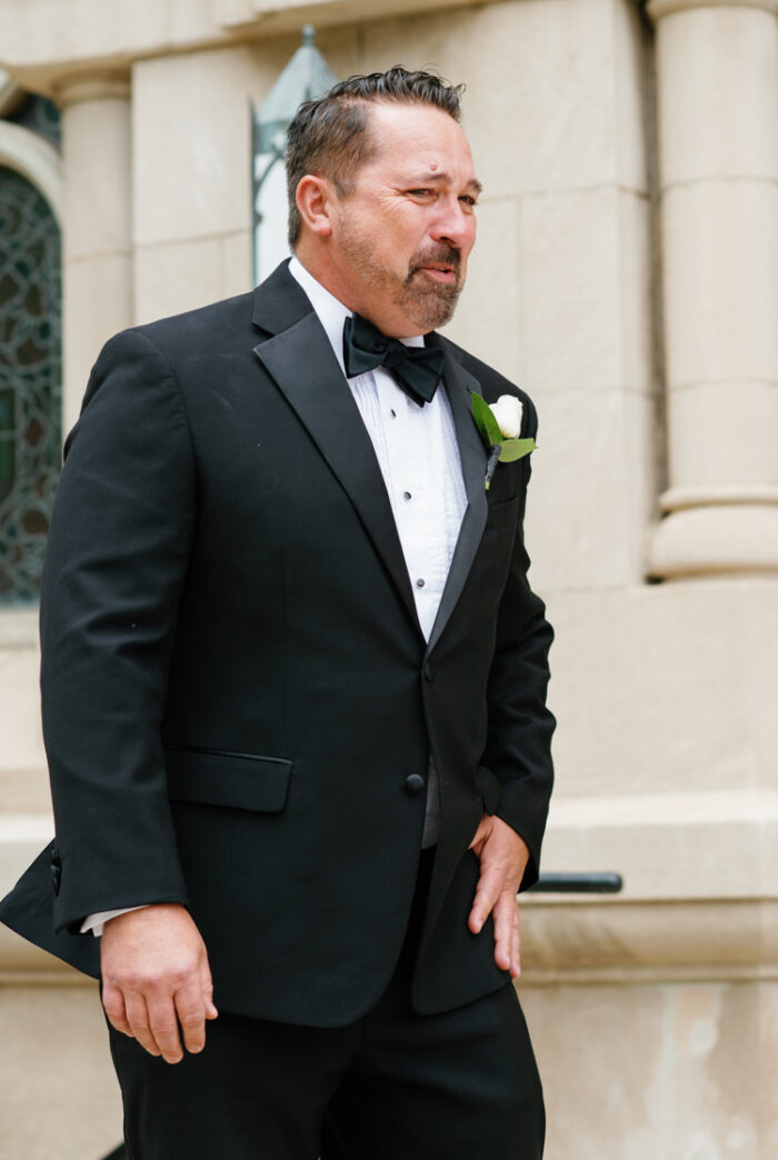 Father of bride crying at first look with bride