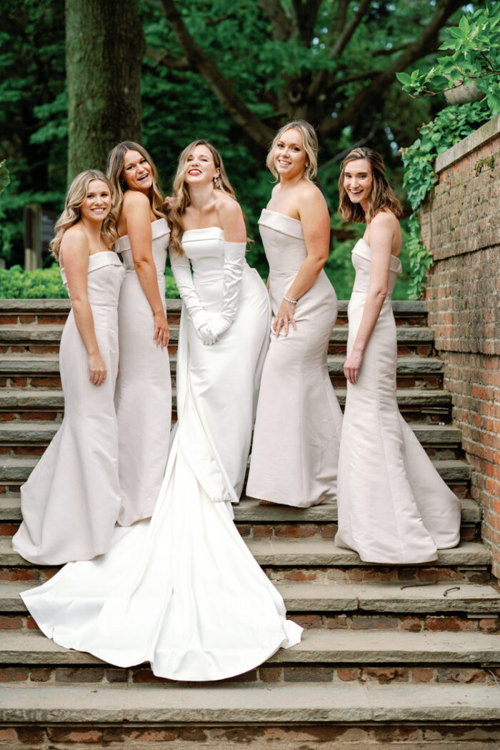Bridal party on top of stairs at English Walled Garden